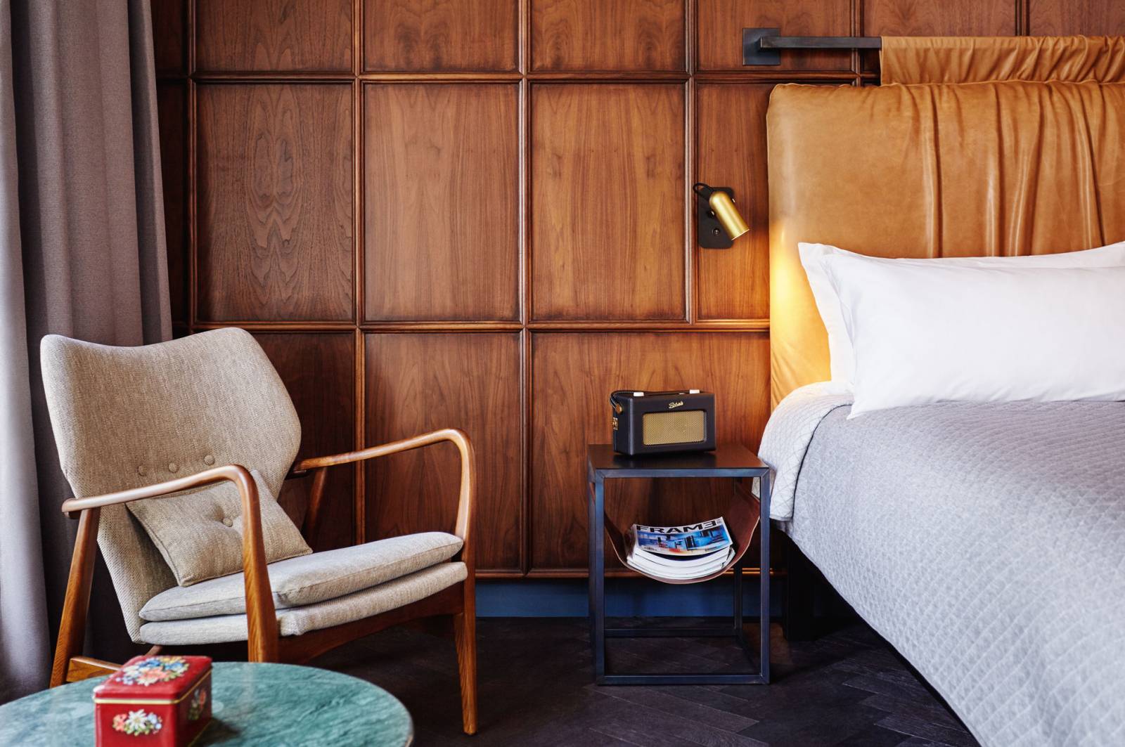 Bedside table and chair in Amsterdam hotel room