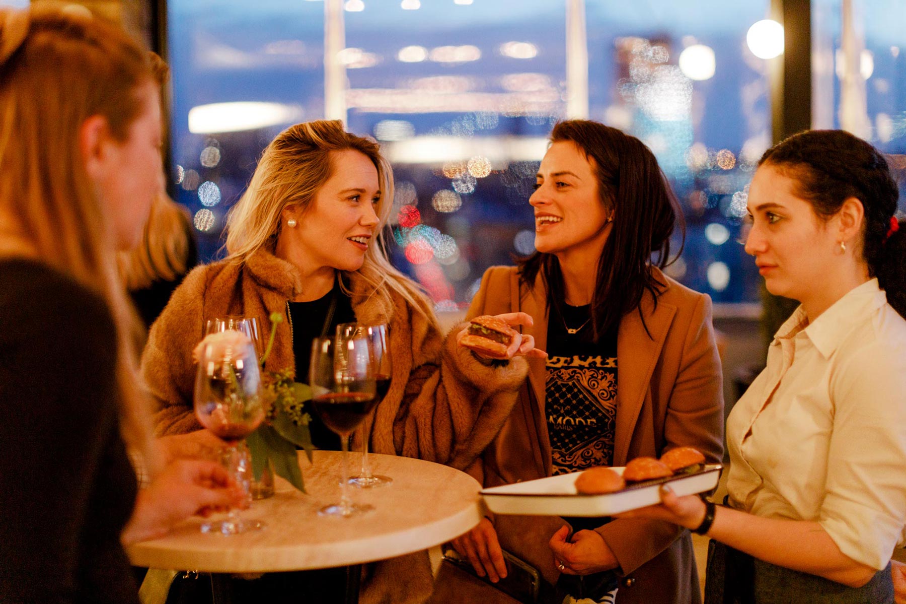 People at a party on the rooftop of the hotel