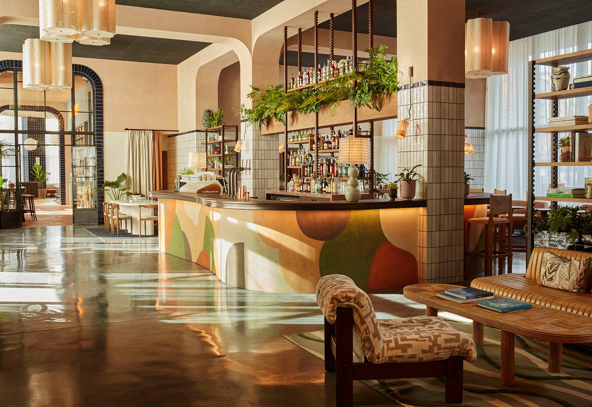 Empty hotel lobby with central bar area