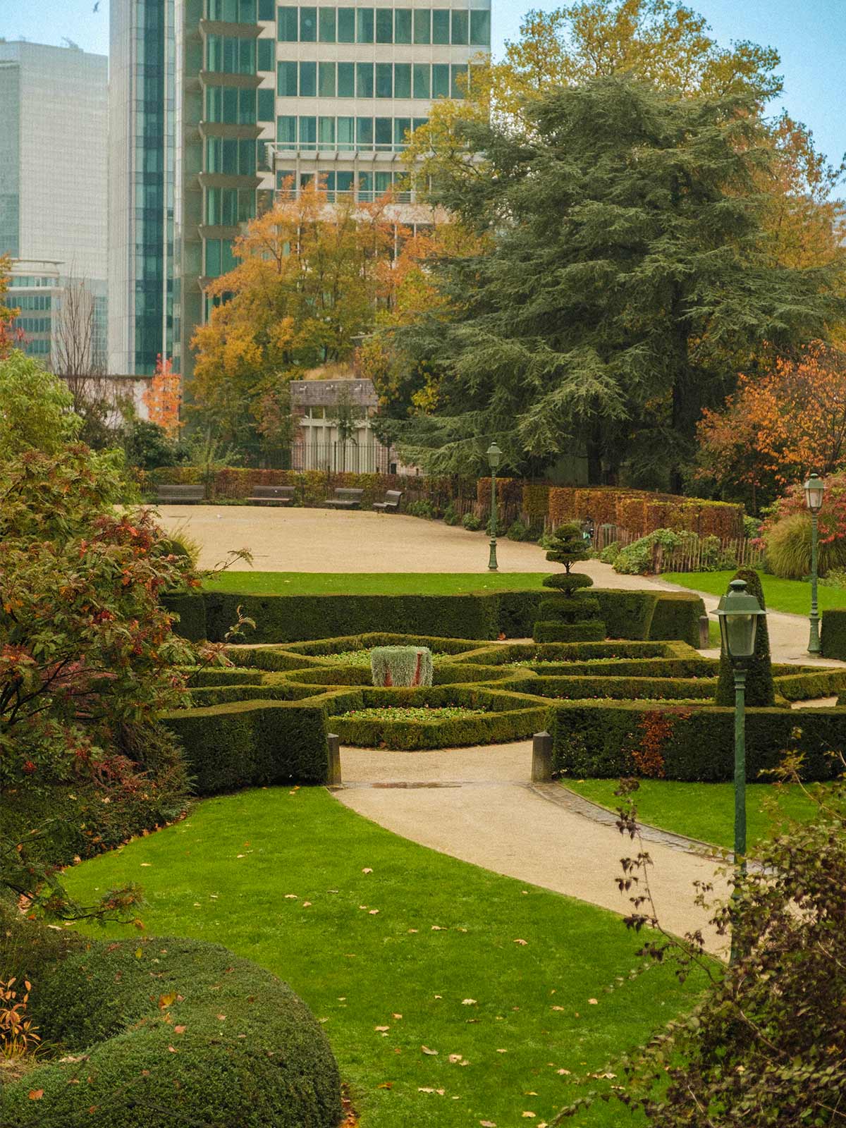 Skyscrapers overlook the neat, green expanse of Brussels Botanical Garden.