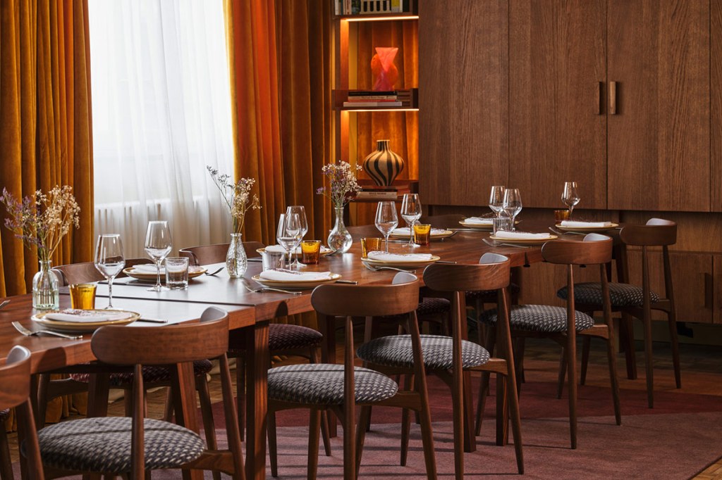 Dining table with place settings in the dining room at Lloyd Amsterdam