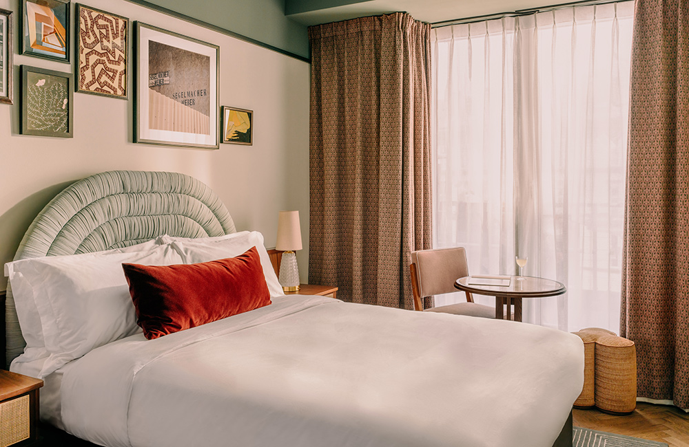 Wide window in the Cosy room admits light over the large comfy bed